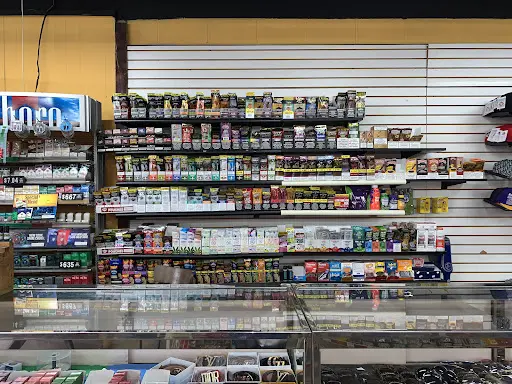 tobacco advertising in convenience stores At the gas pump. On the door. At kids' eye level. Everywhere. How many tobacco  ads do you see here?